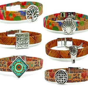 May include: A collection of cork bracelets with various silver-toned charms. The bracelets feature floral and geometric patterns in shades of red, orange, green, and brown. Charms include a tree of life, a seashell, a flower, a bull skull, a turquoise design, and a Celtic knot.