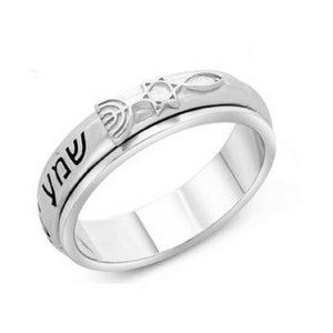 Peut inclure: Une bague tournante en argent avec une étoile de David, une menorah et le mot hébreu "Shabbat" gravé sur la bande.