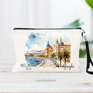 Beautiful watercolor design of Nice France in the middle of this linen wristlet bag. It is personalized with your name on bottom right, with Nice France and the year on the bottom left.