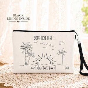 May include: A rectangular off-white canvas pouch with a black wrist strap and black zipper. The front features a black line art design of palm trees, a sun, and birds. Text reads: YOUR TEXT HERE, and also text here, and 2026. Black lining inside.
