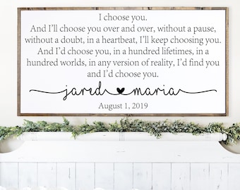 May include: A rustic wooden sign with a white background and black text. The text reads "I choose you. And I'll choose you over and over, without a pause, without a doubt, in a heartbeat, I'll keep choosing you. And I'd choose you, in a hundred lifetimes, in a hundred worlds, in any version of reality, I'd find you and I'd choose you. jared ♥ maria August 1, 2019"