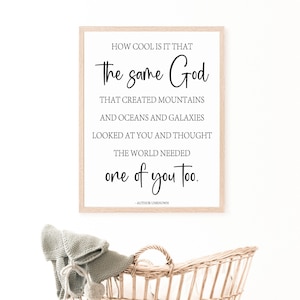 May include: A framed print with a white background and black text that reads "How cool is it that the same God that created mountains and oceans and galaxies looked at you and thought the world needed one of you too." The text is attributed to "Author Unknown".