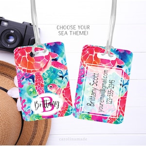 May include: Personalized luggage tag with a watercolor design of sea turtles and coral. The tag features a pink initial "B" and the name "Brittany" in a pink and white font. The back of the tag has a space for contact information.