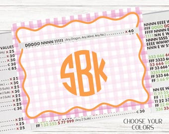 May include: A personalized card with a pink and white gingham pattern and an orange border. The card features the initials "SBK" in a circular design. The text "CHOOSE YOUR COLORS" is visible.