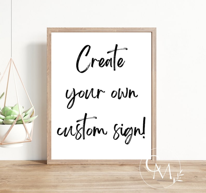 May include: A white framed print with black calligraphy that reads "Create your own custom sign!"