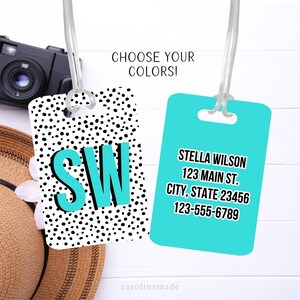 May include: Two luggage tags, one with black and white polka dots and the initials "SW" in turquoise, and the other solid turquoise with the text "STELLA WILSON 123 MAIN ST. CITY, STATE 23456 123-555-6789".