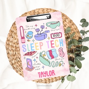 May include: A pink clipboard with a colorful illustration of sleep tech items, including a sleep mask, earplugs, a white noise machine, and a sleep tracker. The text "SLEEP TECH" is written in rainbow colors. The name "TAYLOR" is written in pink at the bottom of the clipboard.