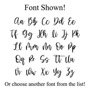 May include: A white background displays a cursive font alphabet in black. The text "Font Shown!" is at the top, and "Or choose another font from the list!" is at the bottom. The letters are in uppercase and lowercase.