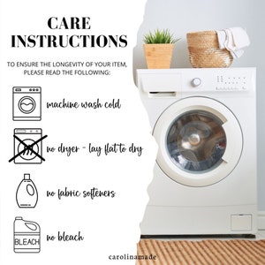 May include: Care instructions for a garment: machine wash cold, lay flat to dry, no dryer, no fabric softeners, no bleach. The instructions are shown next to a white washing machine with a brown woven rug underneath.