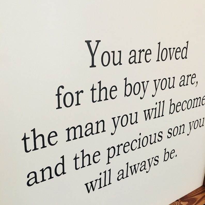 May include: Black and white text on a white background reads: "You are loved for the boy you are, the man you will become and the precious son you will always be."