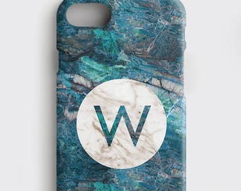 May include: A blue and green marble phone case with a white circle containing the letter "W" in the center.
