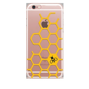 May include: A clear phone case with a honeycomb pattern in yellow and a black bee illustration. The case is designed for an iPhone.