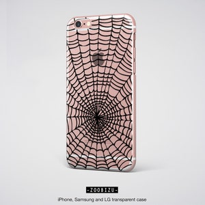 Peut inclure: Une coque de t&eacute;l&eacute;phone transparente avec un motif de toile d'araign&eacute;e noire. La coque est compatible avec les t&eacute;l&eacute;phones iPhone, Samsung et LG.