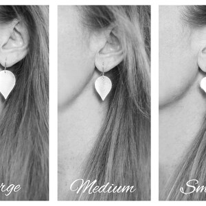 May include: Three images showing the same silver teardrop-shaped earrings in different sizes: large, medium, and small. The earrings are worn by a person with long hair.