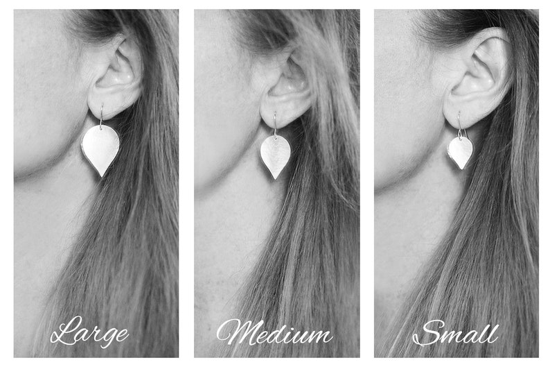 May include: Three images showing the same silver teardrop-shaped earrings in different sizes: large, medium, and small. The earrings are worn by a person with long hair.