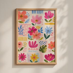 May include: A framed wall art print featuring a grid of colourful floral illustrations. The artwork displays various flowers in shades of pink, orange, yellow, and blue, interspersed with green leaves, polka dots, and striped patterns on a light background.