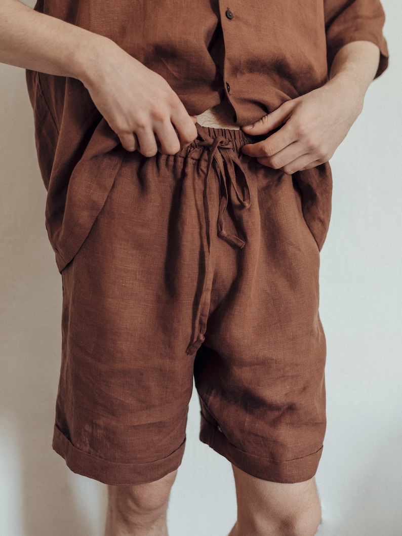May include: A pair of brown linen shorts with a drawstring waist.