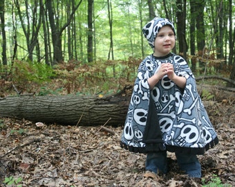 Skulls - Cozy Gozy Travel Capes are warm winter kid fleece car seat blanket capes that are safe for car seats. Convenient and cute!