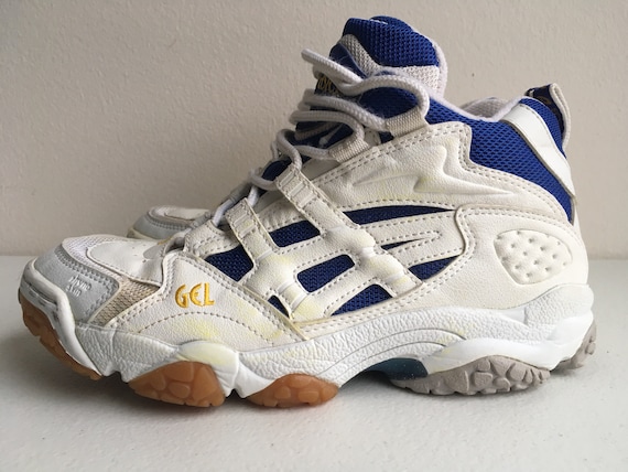 white and gold volleyball shoes