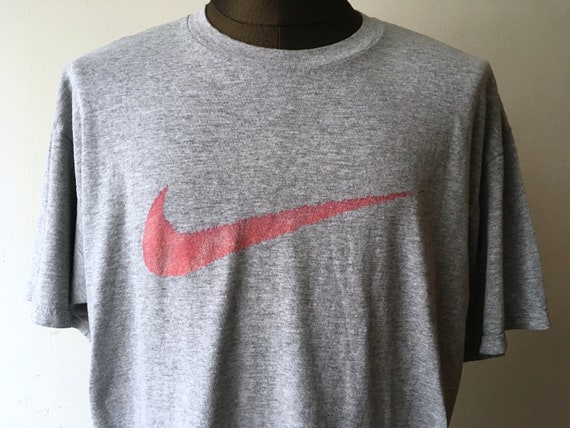 gray and red nike shirt