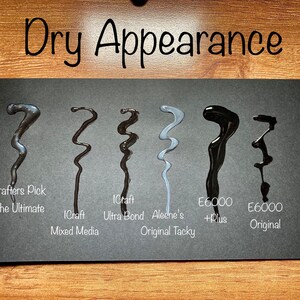 May include: A black card displays six wavy lines of different adhesives, each labeled with its brand and type. The text "Dry Appearance" is at the top. The adhesives vary in color from dark gray to black and light gray.