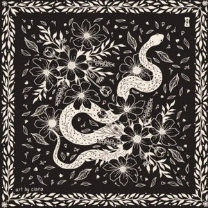 May include: Black and white illustration of a snake curled around flowers. The snake is outlined in white with black spots. The flowers are stylised and have multiple petals. The background is black. The text "art by ciara" is in the bottom left corner.