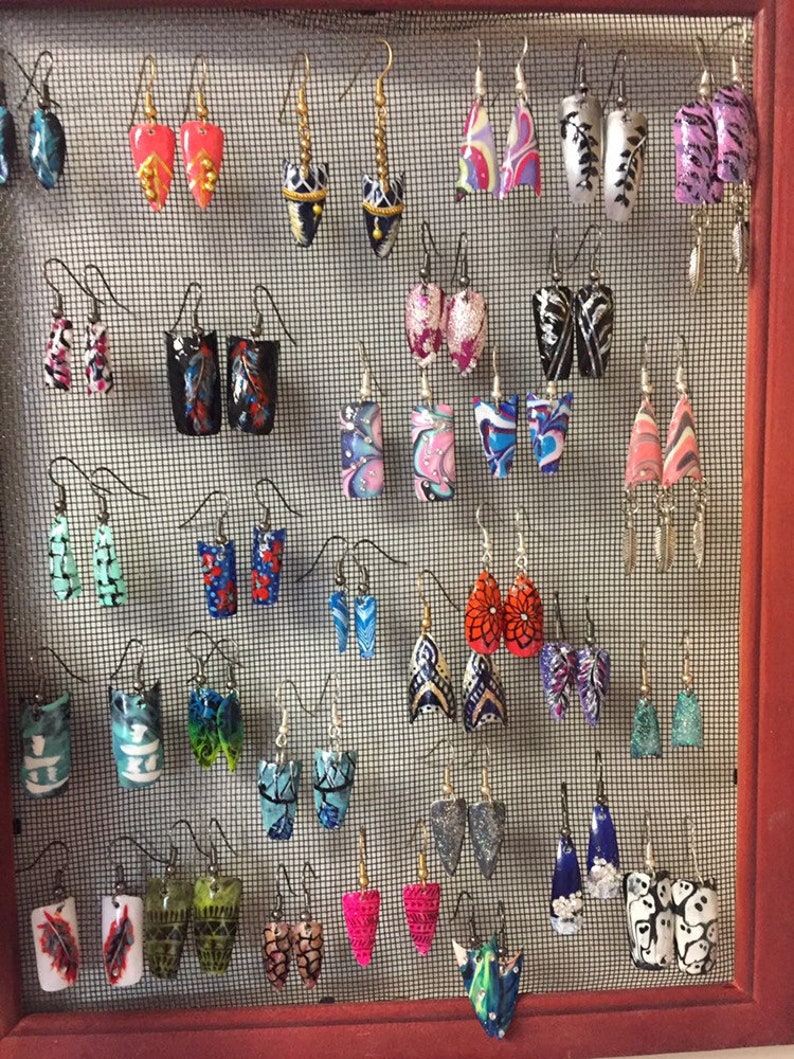 Capsule nails earring