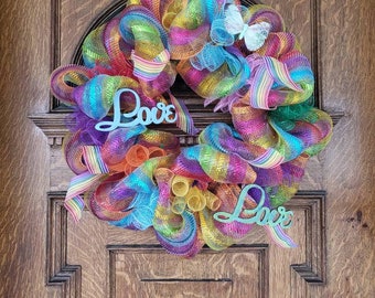 Pride wreath, love queer spring butterfly, make your door welcoming to all, show you care respect and support your friends and neighbors,