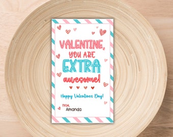 May include: A pink and blue striped Valentine's Day card with the text "Valentine, you are extra awesome!" and "Happy Valentine's Day!" with a heart design. The card is signed "From Amanda".