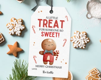 May include: A white gift tag with a gingerbread man illustration and the text "A little treat for someone so sweet! Merry Christmas! Love, The Halls".