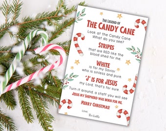 May include: A white card with red and white candy canes and red and green holly. The card has the text "The Legend of The Candy Cane" and explains the meaning of the candy cane's colors and shape. The text reads: "Look at the Candy Cane What do you see? Stripes that are RED like the blood shed for me. WHITE is for my Savior who is sinless and pure. 'J' IS FOR JESUS my Lord, that's for sure. Turn it around, a staff you will see JESUS MY SHEPHERD WAS BORN FOR ME. MERRY CHRISTMAS! Love, The Halls"