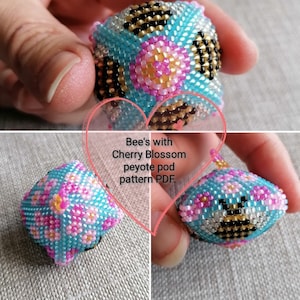 May include: A beaded peyote stitch ring with a bee and cherry blossom design. The ring is blue, pink, yellow, black, and white. The text "Bee's with Cherry Blossom peyote pod pattern PDF." is on the image.