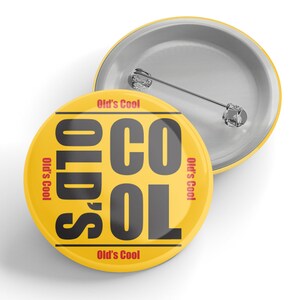 May include: A yellow button with the text "Old's Cool" in black and red. The text is arranged in a vertical stack with the word "Old's" at the top and "Cool" at the bottom. The text is repeated four times around the button.