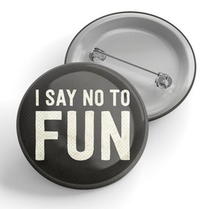May include: A black button with white text that reads "I say no to FUN".