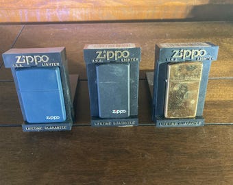 Zippo Lighters. 3 Lighter Package. 1 Black, 1 Blue, 1 Brass.