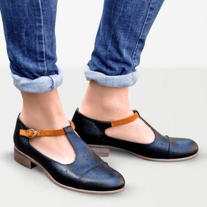 Jane - Women&#39;s black Mary Jane shoes with suede buckle strap, delicate brogues and elegant soles, fully handcrafted and customizable