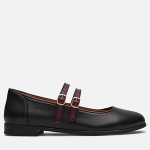 May include: Black leather ballet flats with double burgundy straps and gold buckles.