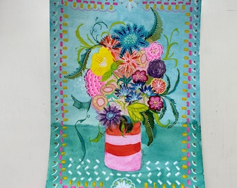 May include: Watercolor painting of a vibrant bouquet of flowers in a pink vase with red stripes. The flowers are a mix of colors, including yellow, pink, blue, and purple, set against a teal background with decorative borders.