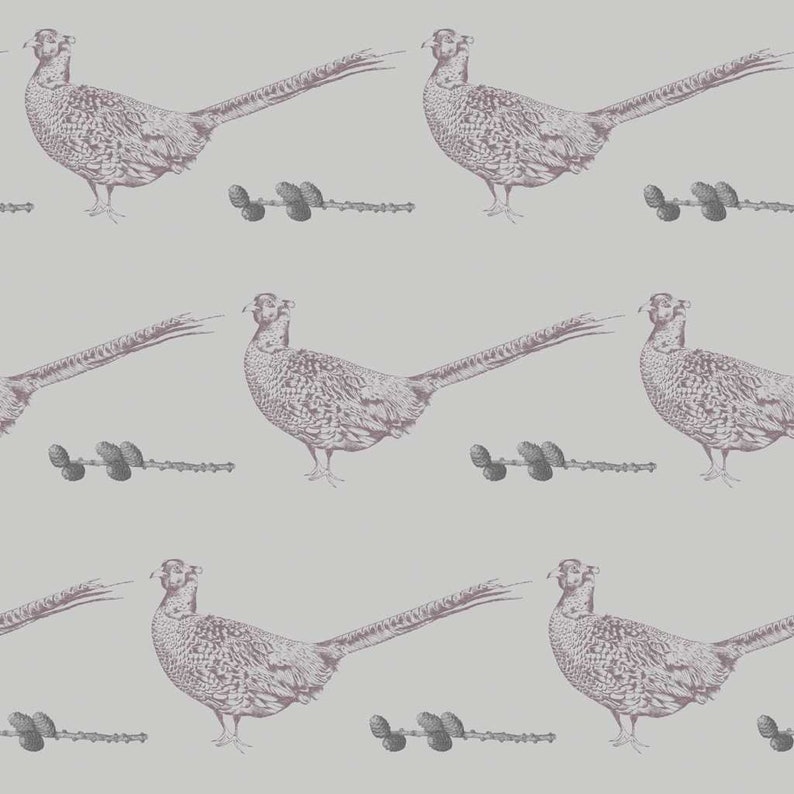 May include: A seamless pattern featuring a repeating design of a pheasant bird with a long tail and a sprig of pine cones. The pheasant and pine cones are in shades of gray and pink against a light gray background.