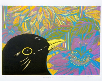 Blackbird in the garden, a colourful limited edition linocut print