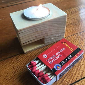 Wooden tea light holder with matches