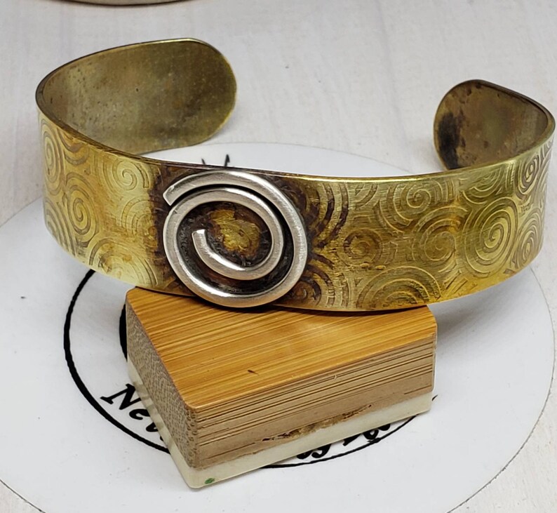 Celtic Inspired Hand Embossed Fire Treated Brass Cuff with Sterling Silver Spiral