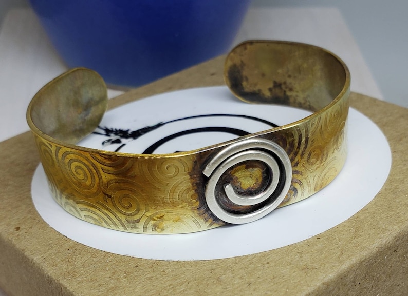 Celtic Inspired Hand Embossed Fire Treated Brass Cuff with Sterling Silver Spiral