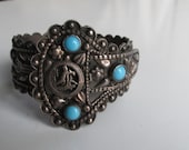 Vintage Sterling Silver Repousse Egyptian Revival Turquoise Glass Buckle Bracelet