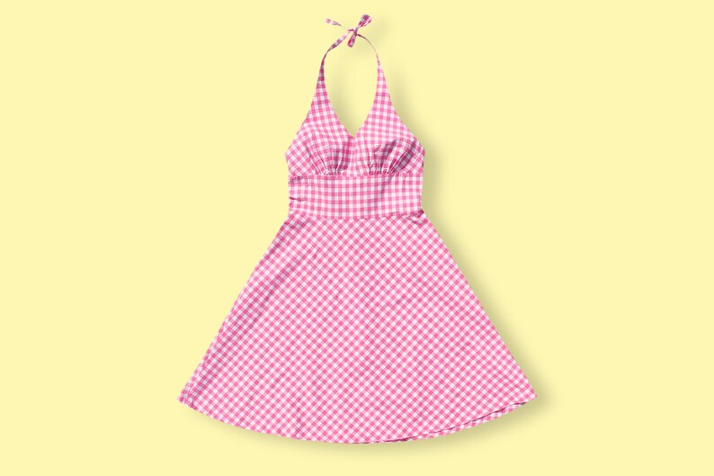 May include: A pink and white gingham halter dress with a fitted bodice and a full skirt.