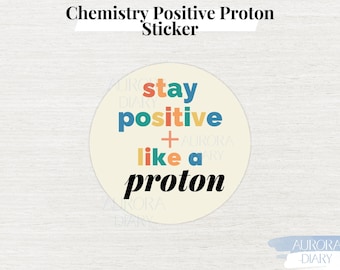 May include: A round sticker with a white background and colourful text that reads "stay positive + like a proton".