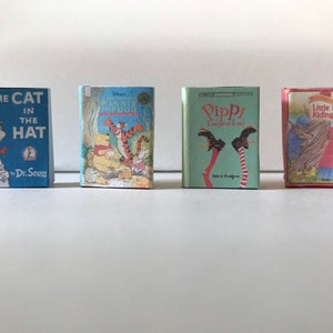 May include: Four miniature hardcover books with colorful covers. The books are titled "The Cat in the Hat" by Dr. Seuss, "Winnie the Pooh", "Pippi Longstocking", and "Little Red Riding Hood".