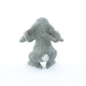 May include: A small, gray, ceramic rabbit figurine with a white tail. The rabbit is sitting with its ears up and its front paws raised.