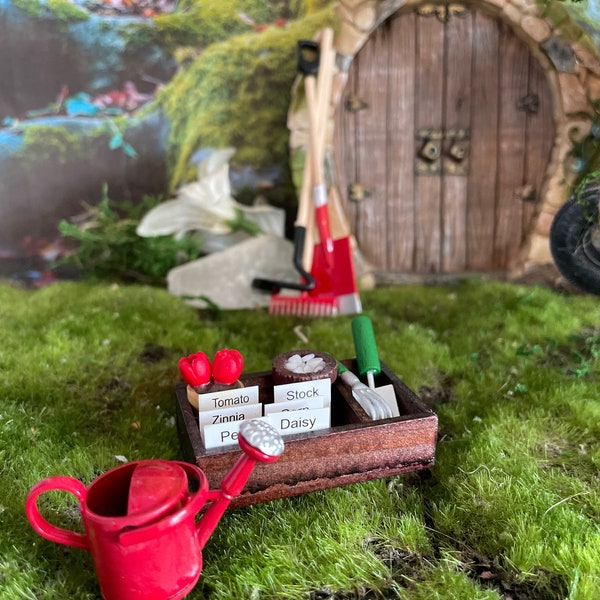 5 piece fairy garden/dollhouse set Included in this set is a watering can, seed box, hoe, spade and rake