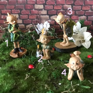 Pixie lovers garden pixie and baby dragon, pixie laying on tummy in thought, pixie gardening with shovel and bucket and owl sitting on head